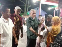 Usai Penurunan Bendera Merah Putih, Camat Talawi Serahkan Bansos